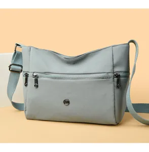 Oxford cloth crossbody bag for women, casual shoulder bag with multiple zipper pockets.