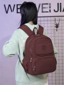 Detailed view of women casual travel backpack, lightweight nylon multi-layer school daily daypack.