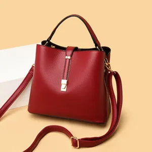 Women leather bucket bag stylish shoulder crossbody bag with unique metal lock design