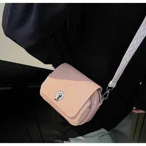 Pink mini square bag detail shot, featuring woven texture, twist lock, and wide strap.