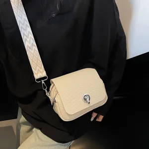 Chic woven mini crossbody bag for women with twist lock, wide strap, and multi-layer design.