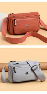 Solid color women crossbody shoulder bag detail view, multi zipper compartment casual daily commuter bag.