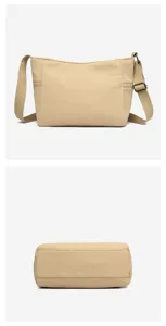 Casual khaki oxford cloth crossbody bag for women with wide shoulder strap and zippers.