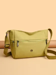 Casual nylon crossbody bag for women, large capacity travel shoulder bag with multiple zippered pockets.