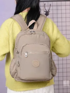 Zaino casual in nylon per uomo e donna, zainetto scolastico da viaggio con tasche multiple.