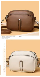 Detailed view of the soft leather women crossbody bag with double zippers and metal lock clasp.