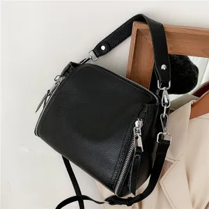 Black genuine leather crossbody shoulder bag for women, stylish casual saddle bag with zippers.