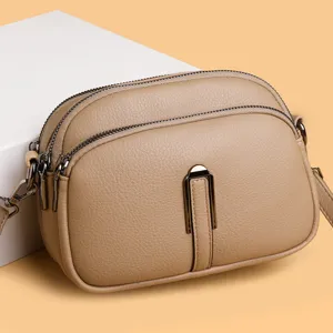 Women's leather crossbody bag stylish soft shoulder mobile phone purse with multiple zippers.