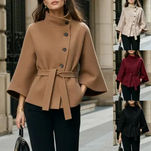 Detail view of the elegant asymmetric button wool coat featuring a stylish waist belt.