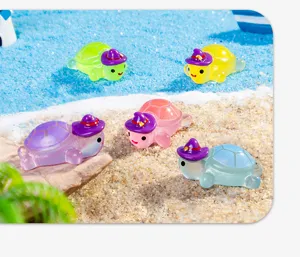 Luminous resin mini turtle figurines with cute witch hats, perfect for desktop or car decor.