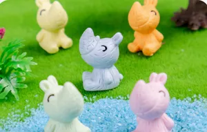Detailed view of cute mini resin rhino figurines in matte colors, perfect for desktop decor.