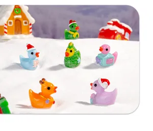 Detailed shot of cute mini resin Christmas ducks, perfect DIY decoration accessories for holiday crafts.