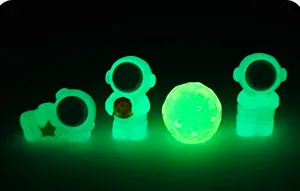Glow in the dark astronaut resin miniature figurines set, cute space figures for desktop decor.