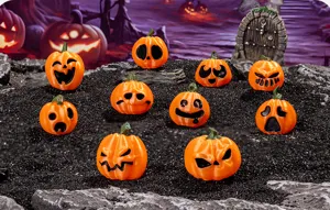 Halloween mini pumpkin figurines detail shot, funny expression resin DIY party decor props.