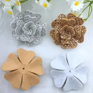 Detailed view of sparkly rhinestone rose shoe flowers and felt backing, perfect for DIY fashion.