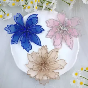 Exquisite mesh rhinestone flower appliques for bridal hair accessories and wedding gowns.