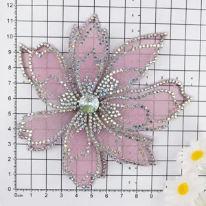 Pink mesh sequin flower applique size chart display with grid background for apparel DIY.