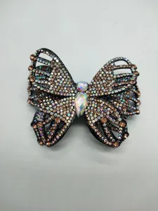 Detailed view of a sparkling butterfly hair clip decorated with colorful rhinestones.
