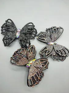 Detailed view of exquisite butterfly rhinestone hair clips with colorful crystal embellishments.