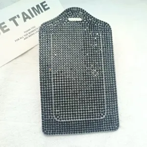 Detailed view of the sparkling black rhinestone card holder surface, showing exquisite craftsmanship.