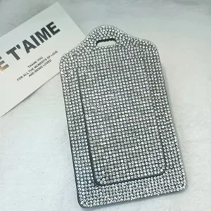 Rhinestone card holder detail close-up, sparkly crystal badge cover, shiny document sleeve