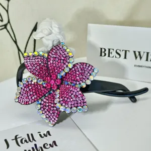 Exquisite sparkling rhinestone hair claw clip featuring stunning pink and purple crystal flowers