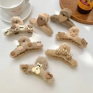 Brown plush hair claw clip for women, cute furry shark clip with bear and heart design.