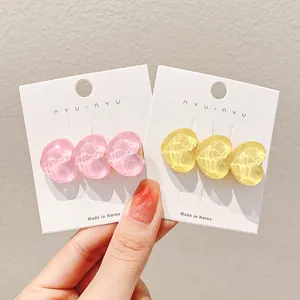 Sweet pink and yellow heart resin hair clips cute Korean style hair pins for daily wear.