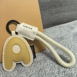Letter A leather keychain accessory detail view, stylish bag charm and cute gift pendant.