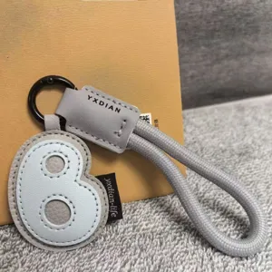 Leather number 8 keychain bag charm, stylish creative grey braided rope pendant accessory.