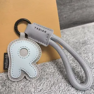 Leather alphabet R keychain with woven strap stylish bag charm accessory gift for women and men