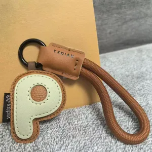 Original leather letter P keychain detail, stylish dopamine bag charm accessory gift.