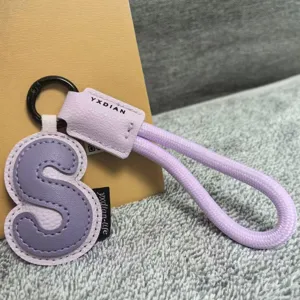 Purple leather letter S keychain bag charm, stylish dopamine aesthetic accessory gift for women.