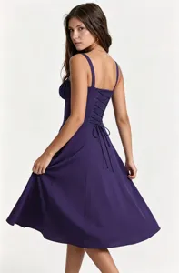 Details of the purple midi dress showcasing the elegant corset lace-up back design.