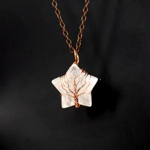 Close-up detail of a handmade wire-wrapped life tree star crystal pendant necklace.