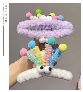 Plush hair claw clip with cute googly eyes and colorful pom-poms, fun dopamine style hair accessory.