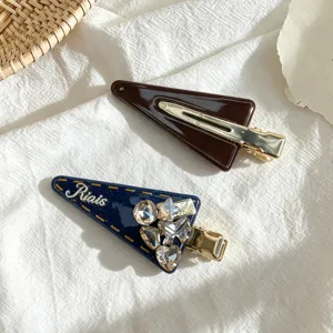 Detailed view of vintage rhinestone triangle hair clips, elegant side bangs clip for women.