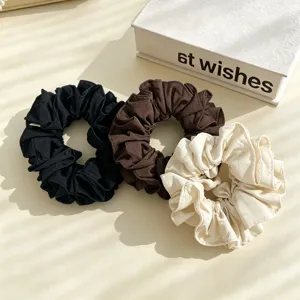 Set of 3 fabric hair scrunchies in black, brown and beige. Elegant pleated ponytail holders.