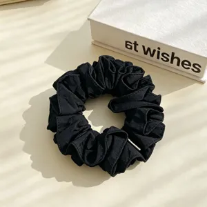 Black fabric hair scrunchie with metal detail minimalist ponytail holder for women daily hair styling