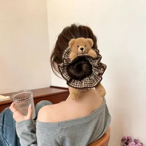 Plush bear plaid hair scrunchie detail shot, cute retro aesthetic hair accessory for styling.
