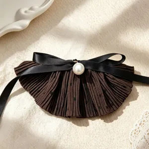 Brown pleated hair bow detail with black ribbon and elegant pearl accent for sweet style.