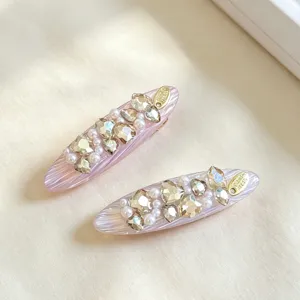 Pink resin hair clip with rhinestones and pearls, elegant duckbill side clip for sweet style.