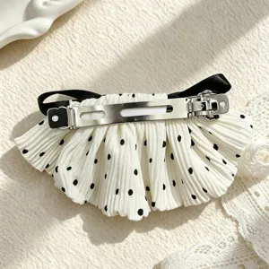 Retro polka dot bow barrette with black ribbon and metal spring clip, perfect for hairstyles.