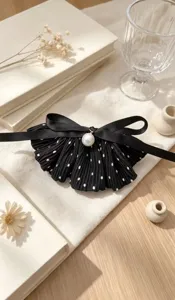 Retro polka dot bow hair clip with pearl pendant, elegant fabric barrette for women's hairstyles.