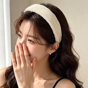 Close-up detail of the Korean retro pleated headband, soft fabric and elegant design style.