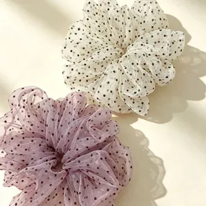 Detailed view of stylish polka dot mesh hair scrunchies, elegant hair ties for women and girls.