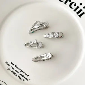 Exquisite silver hair clips detail showcasing sparkling zircon heart and bow designs for styling.