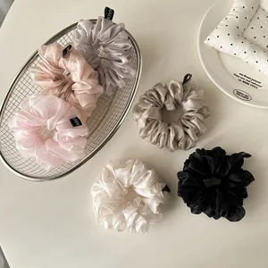 Pearlescent tulle scrunchies detail, fluffy pleated hair ties set in assorted elegant colors.