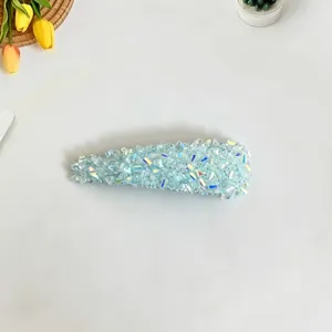 Detail shot of a Korean light luxury rhinestone BB hair clip with shimmering blue crystals.