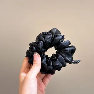 Black sparkly sheer tulle hair scrunchie accessory elegant daily styling detail shot